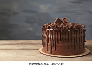 Tasty Chocolate Cake On Grey Wall Background