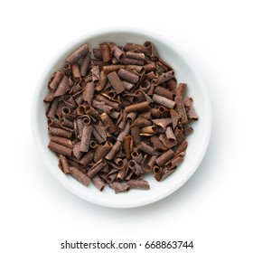 Tasty Chocolate Curls In Bowl Isolated On White Background. Top View.