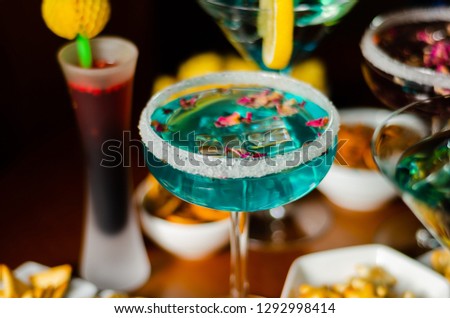 Tasty and colorful drinks based on various alcohols, syrups and liqueurs, unique effect of the bartender's work, party night