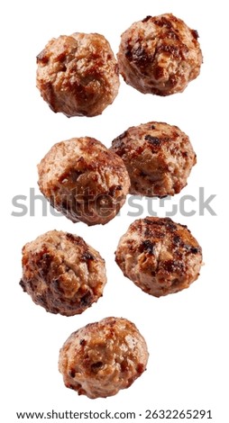 Tasty cooked meatballs falling down on transparent background, ready to be added to any dish