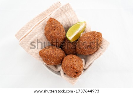 tasty and crispy kibbeh in the bowl and napkins [[stock_photo]] © 
