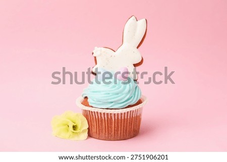 Tasty cupcake with Easter decor on pink background, closeup
