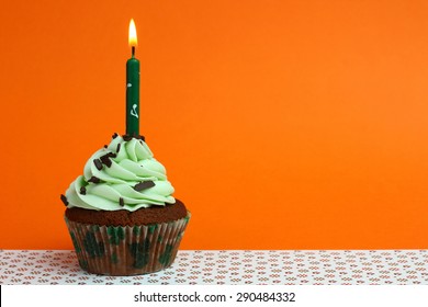 Tasty Cupcake On Orange Background. Birthday