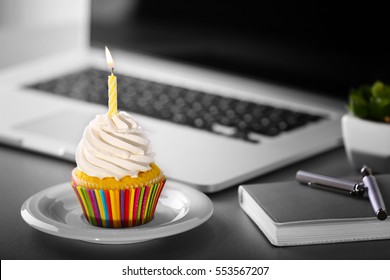 Tasty cupcake on working place - Shutterstock ID 553567207