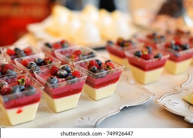 Tasty Cupcakes  On White Cloth. Wedding Reception Table