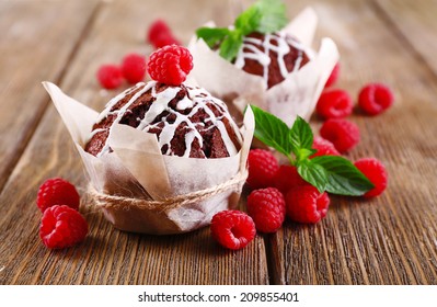 Tasty cupcakes with raspberries on table close-up - Powered by Shutterstock