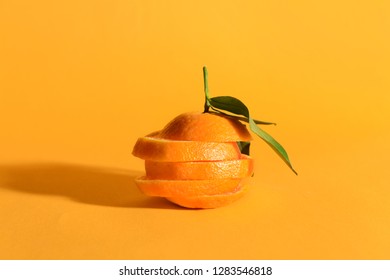 Tasty cut tangerine on color background - Shutterstock ID 1283546818