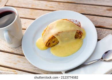 Tasty Dessert, Apple Strudel With Cinnamon And Vanilla Sauce Served With Cup Of Mulled Wine