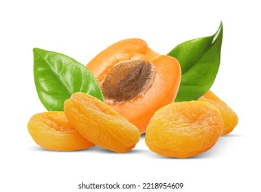 Tasty dried apricots and fresh one with green leaves on white background