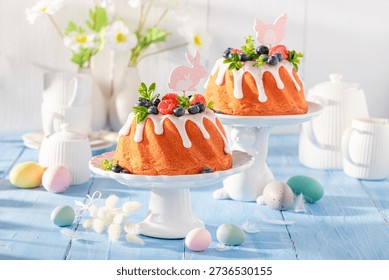 Tasty Easter ring cake accompanied by eggs and willows. Traditional polish easter dessert.