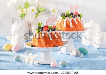 Tasty Easter ring cake accompanied by eggs and willows. Traditional polish easter dessert.