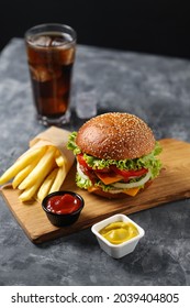 Tasty Fast Food Cheeseburger on Black Background