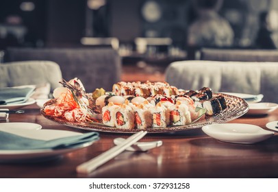 Tasty fresh Japanese sushi with tuna, caviar and shrimps