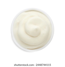 Tasty fresh mayonnaise sauce in bowl isolated on white, top view