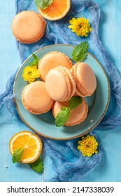 Tasty and fresh orange macaroons as spring snack. Sweet macaroons made of oranges. - Shutterstock ID 2147338039