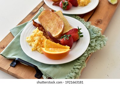 Tasty Gourmet Classic American Breakfast Room Service With Bacon, Eggs, Toast, Fruit, Mimosa. Top View, Photo Concept, Background, Copy Space