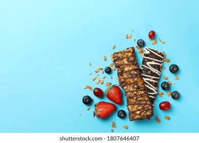 Tasty granola bars on blue background, top view - Powered by Shutterstock