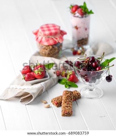 Tasty granola with nuts and yoghurt, sideview
