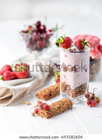 Tasty granola with nuts and yoghurt, sideview