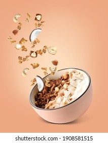 Tasty granola with yogurt and nuts in bowl on color background - Shutterstock ID 1908581515