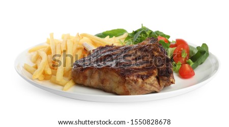 Tasty grilled beef steak, French fries and salad isolated on white