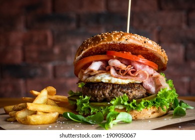 Tasty Hamburger Gourmet. Bacon Egg And Beef Burger. American Food Served With Fries.