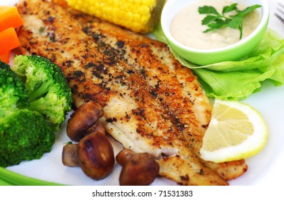 Tasty healthy fish fillet with steamed vegetables