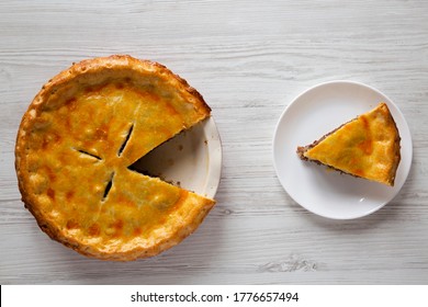 Tasty Homemade Canadian Tourtiere Meat Pie On A White Wooden Surface, Top View. Flat Lay, Overhead, From Above.