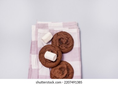 Tasty Homemade Chocolate Chip and Marshmallow Dark Chocolate Cookies Blue Background Top View Horizontal - Shutterstock ID 2207491385