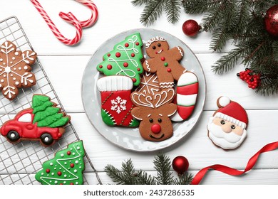 Tasty homemade Christmas cookies and decor on white wooden table, flat lay - Powered by Shutterstock