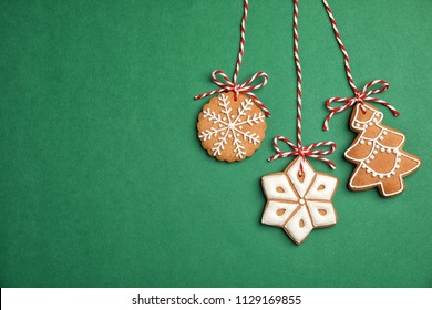 Tasty homemade Christmas cookies on color background