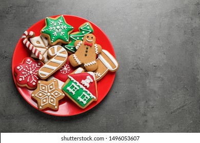 Tasty homemade Christmas cookies on grey table, top view. Space for text