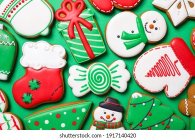 Tasty Homemade Christmas Cookies On Green Background, Flat Lay