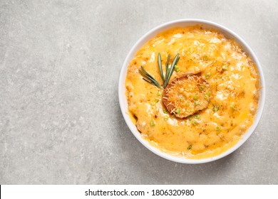 Tasty Homemade French Onion Soup On Grey Table, Top View. Space For Text