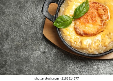 Tasty Homemade French Onion Soup Served On Grey Table, Top View. Space For Text