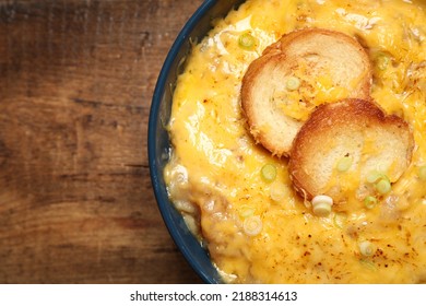 Tasty Homemade French Onion Soup On Wooden Table, Top View