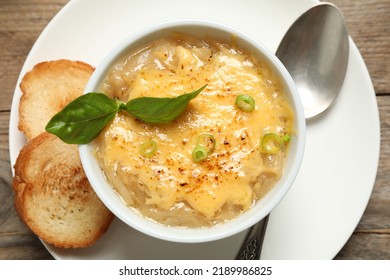 Tasty Homemade French Onion Soup Served On Wooden Table, Top View