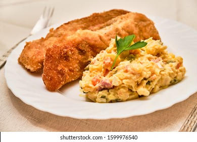 Tasty Homemade Fried Carp Fish With Potato Salad - Kapr A Bramborovy Salat - On White Plate On Cloth With Serving. Czech Traditional Christmas Food.