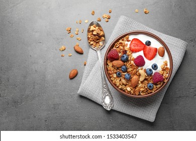 Tasty homemade granola  served on grey table, flat lay with space for text. Healthy breakfast - Powered by Shutterstock