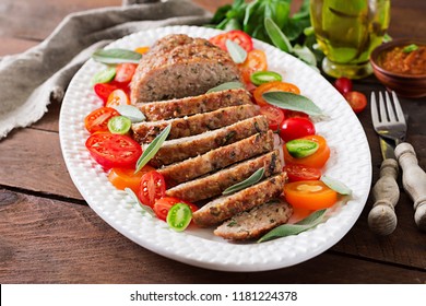 Tasty Homemade Ground  Baked Turkey Meatloaf In White Plate On Wooden Table. Food American Meat Loaf.