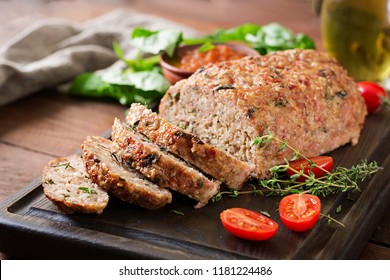 Tasty homemade ground  baked turkey meatloaf on wooden table. Food american meat loaf. - Shutterstock ID 1181224486