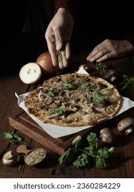 Tasty hot italian pizza Barbecue with Chicken, Mushrooms, Arugula, Mozzarella, Onions on old wooden table. Pizzeria menu. Concept poster for Restaurants or pizzerias