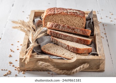 Tasty loaf of breads with ears and grain. Bread in countryside. - Powered by Shutterstock