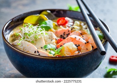 Tasty Malaysian Soup made of coconut milk and shrimps. Classic Malaysian soup with vegetables and meat.