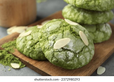 Tasty matcha cookies, almond flakes and powder on grey table, closeup - Powered by Shutterstock