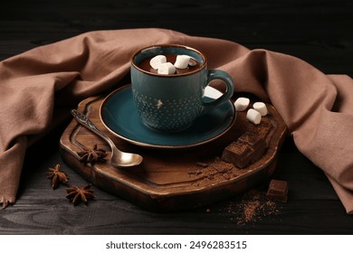 Tasty melted chocolate with marshmallows in cup and spices on dark wooden table, closeup - Powered by Shutterstock