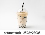 Tasty milk bubble tea in plastic cup on white background