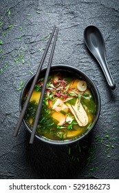 Tasty Miso Soup With Salmon In Black Bowl