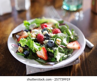 Tasty Mixed Berry Salad With Blue Cheese Crumbles And Walnuts