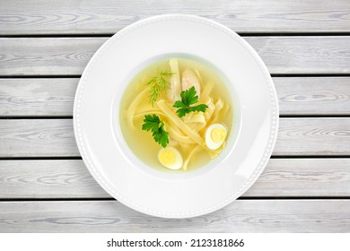 Tasty Noodle Soup With Vegetables In Bowl On The Desk